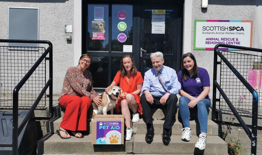 Photo L-R Lynne Ogg, Scotmid Communities Manager, Sharon McSorley and Alan MacLeish, both Scotmid Regional Committee Members, Carrie Giannelli, Pet Aid Co-ordinator and Lily the Beagle.