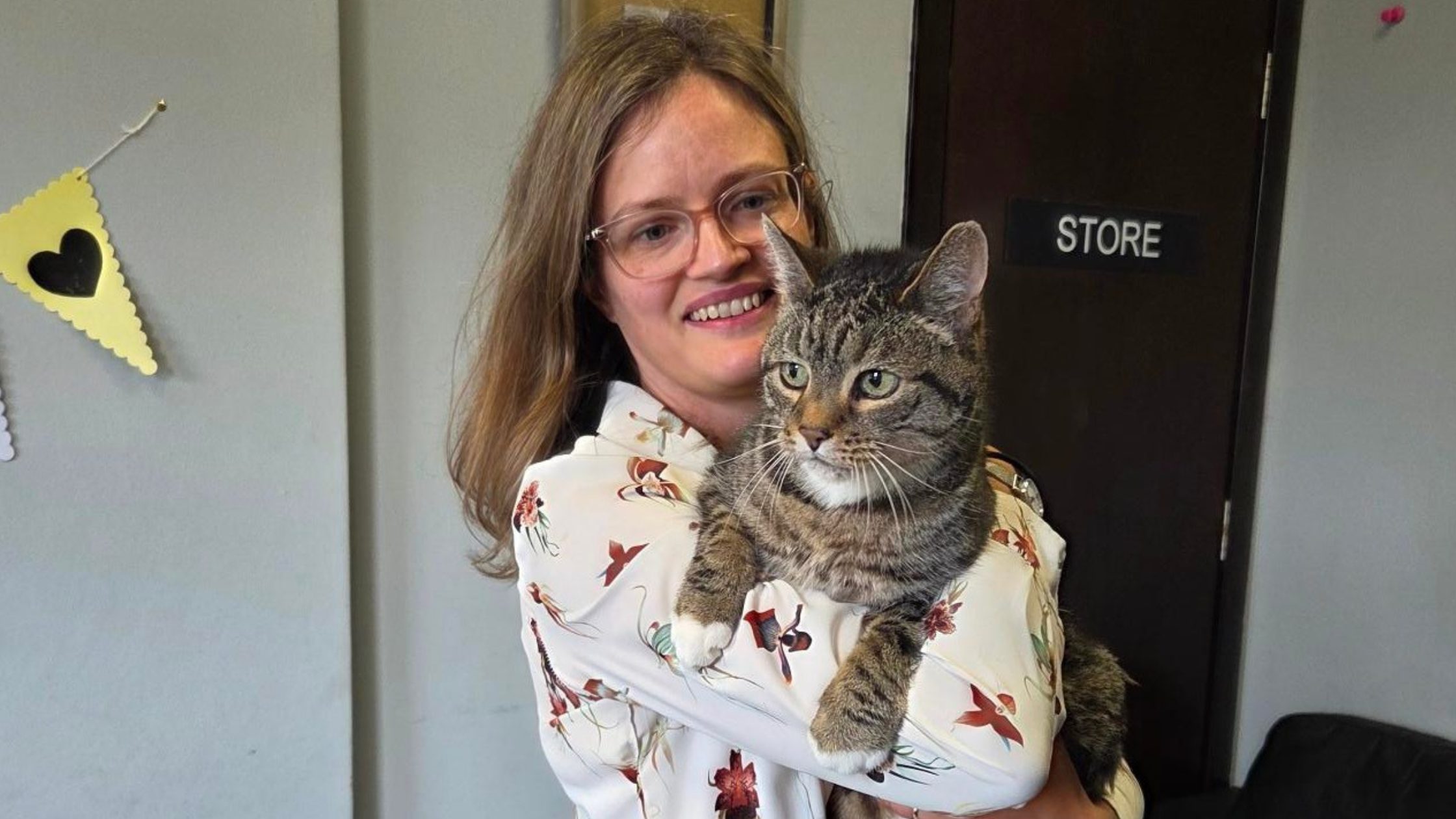 Picture of cat and owner reunited because microchip