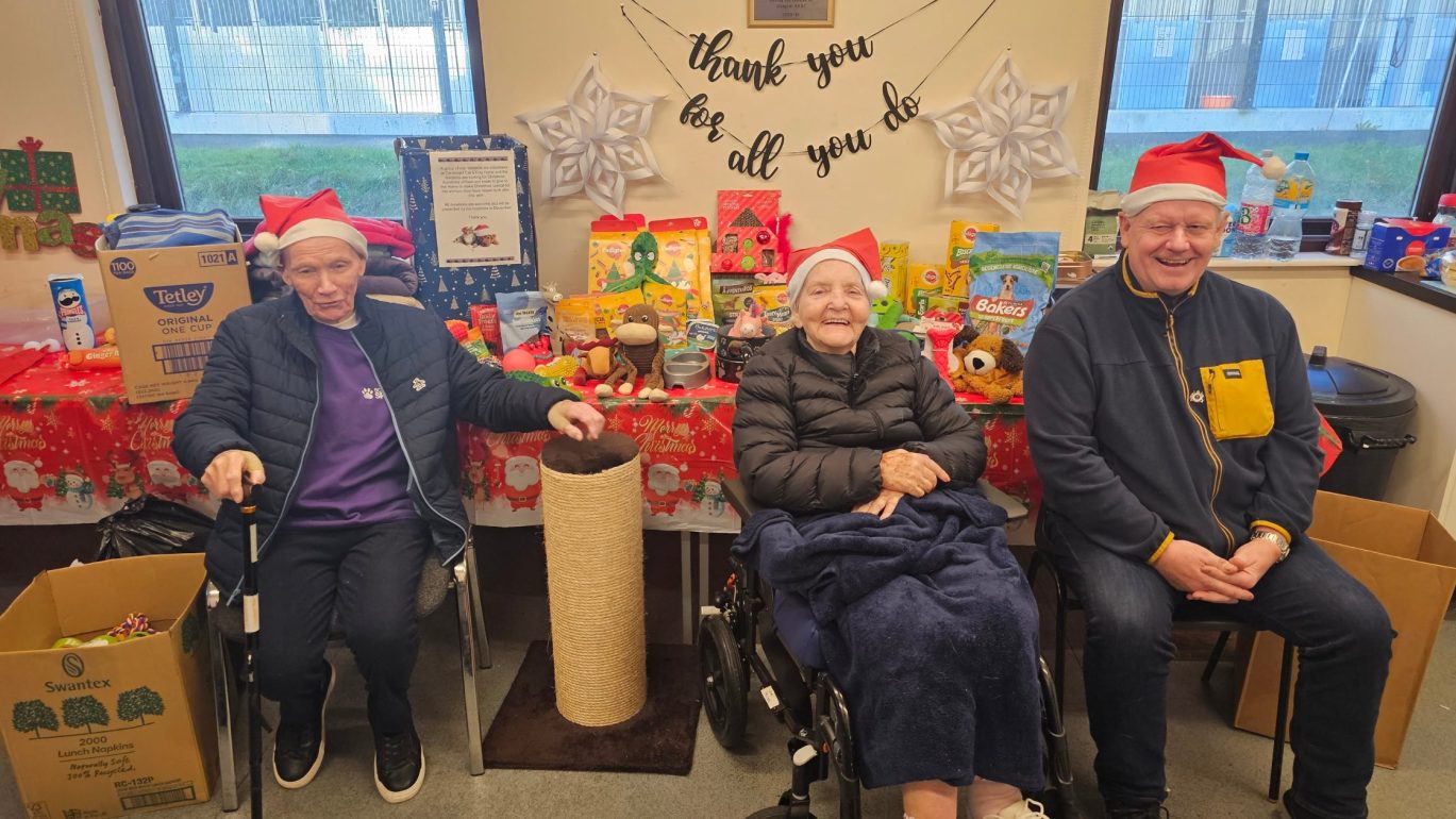 Image of Erskine vets in front of table of pet food
