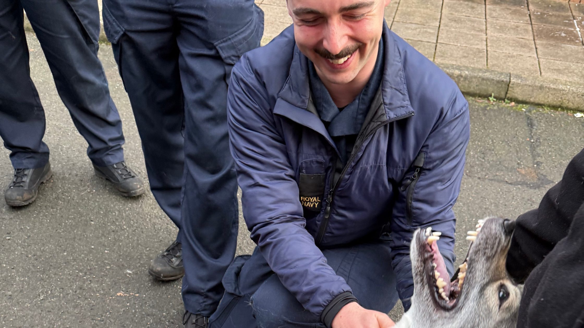 Image of junior sailor with dog