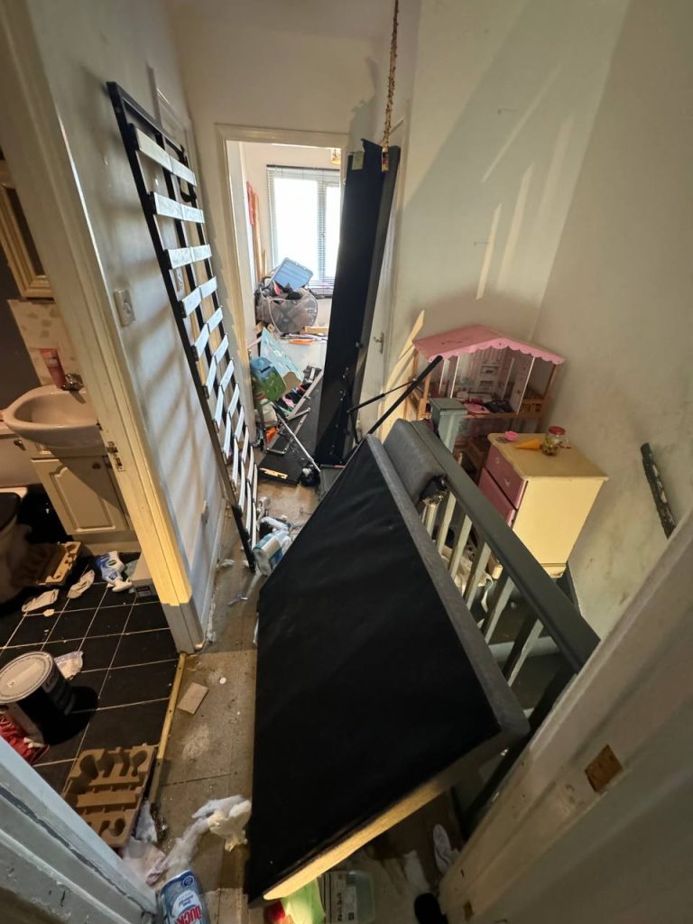 Photograph of the cluttered bedroom taken from the Montgomery case