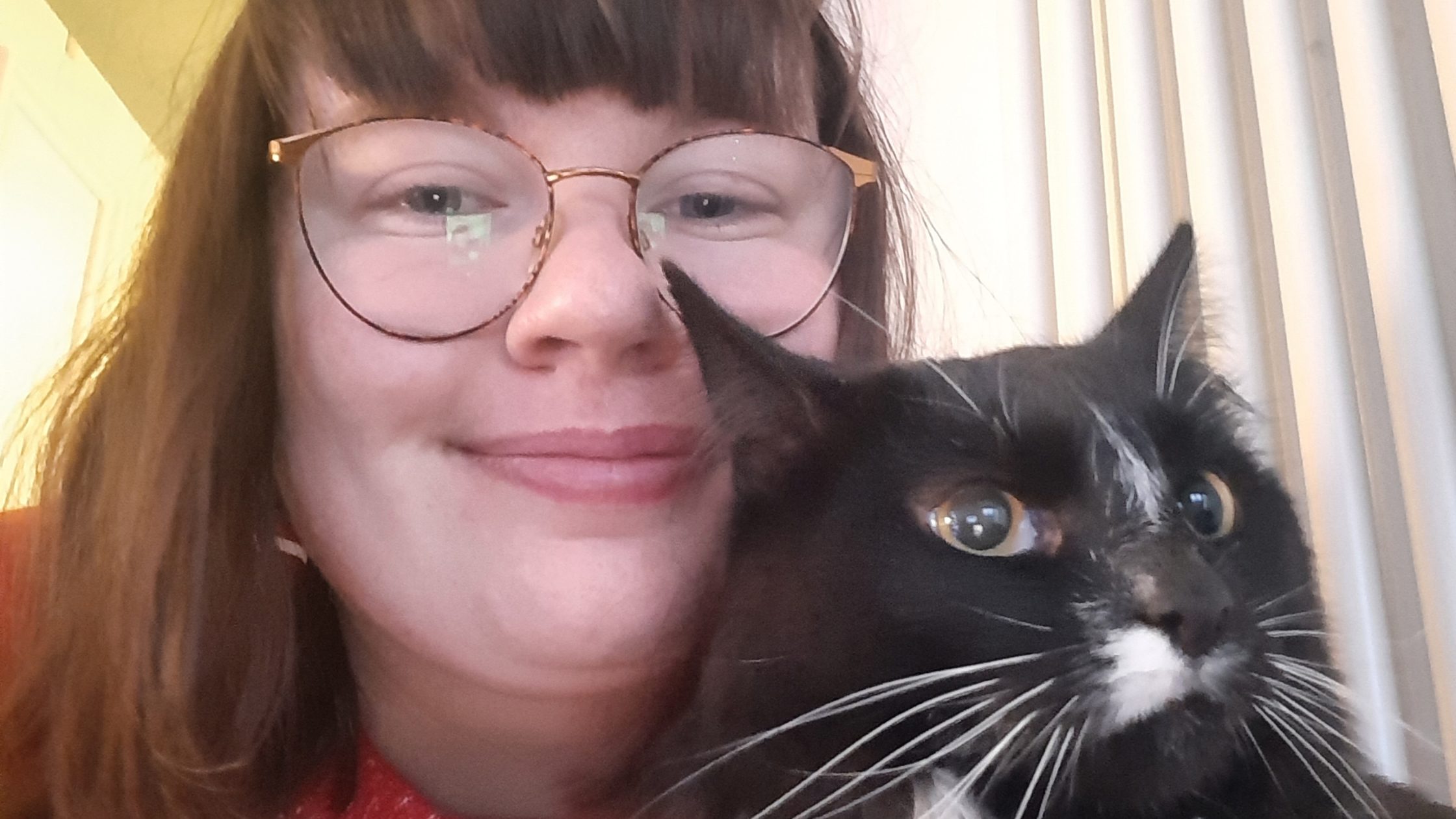 Young woman and black and white cat