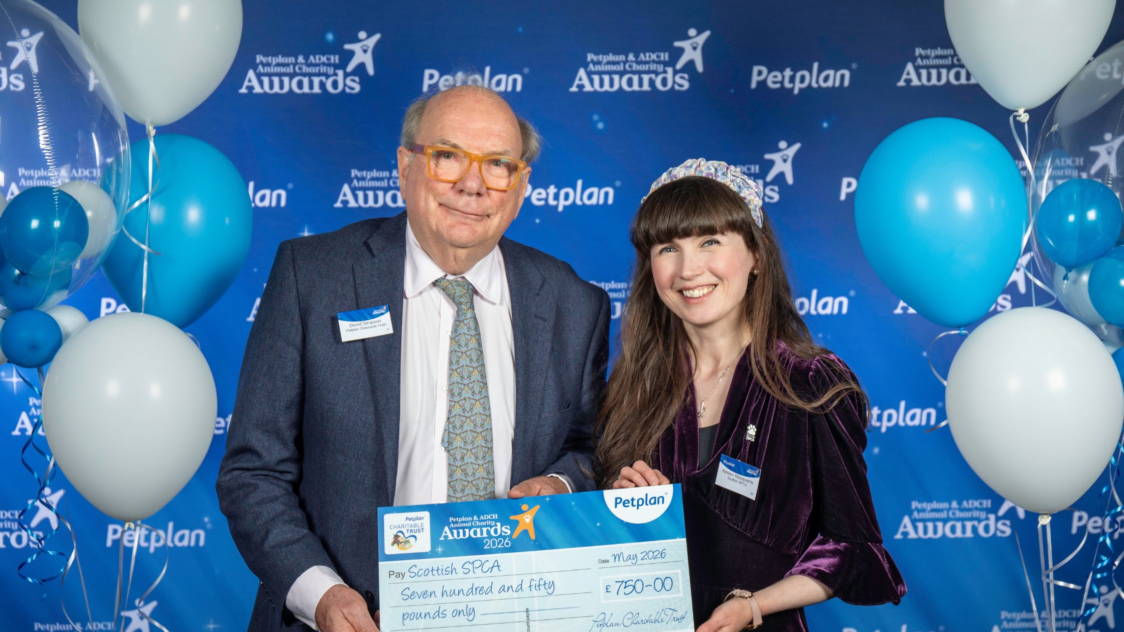 Volunteer of the year being handed the cheque
