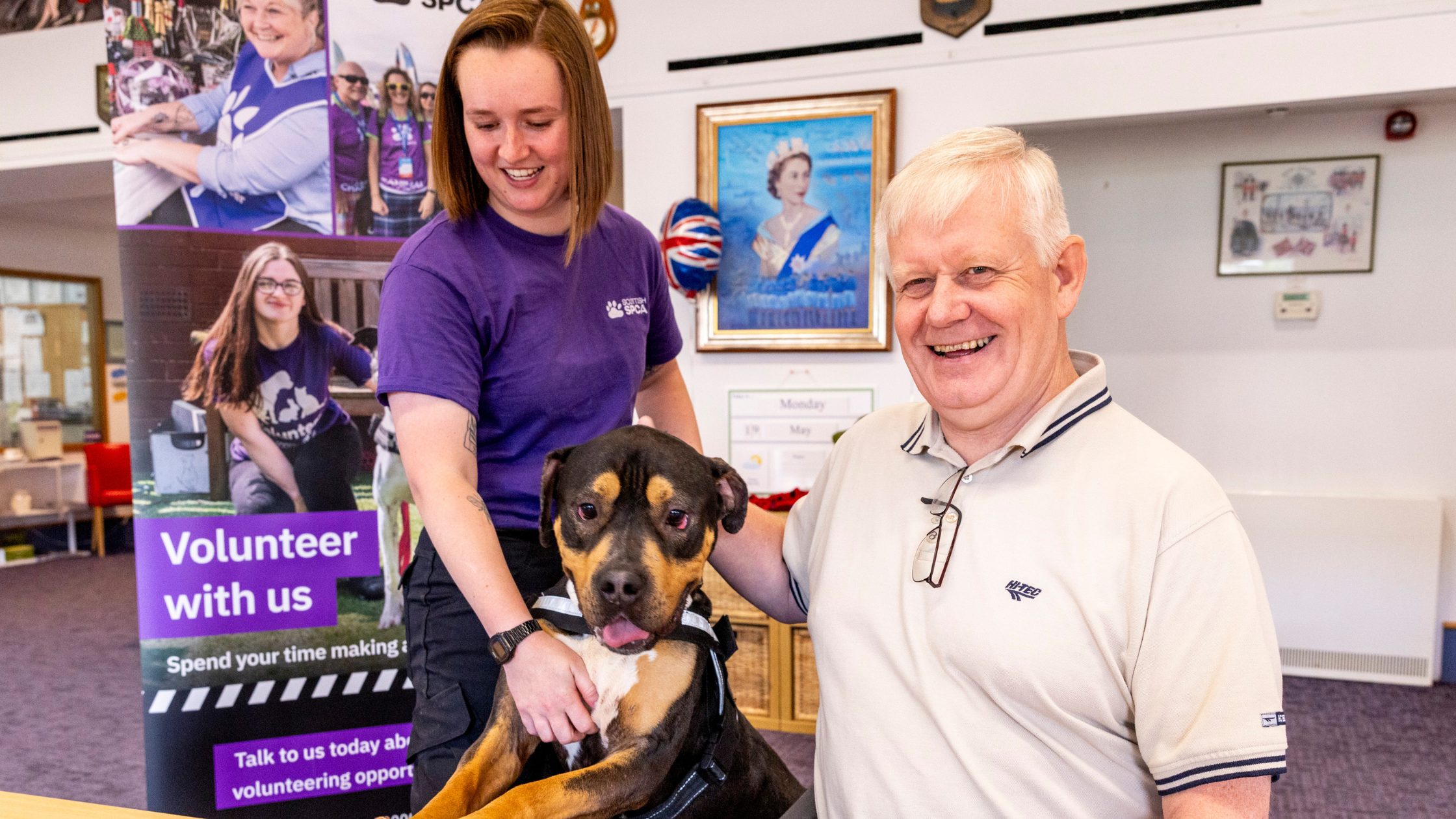 Image of Scottish SPCA worker and Erskine veteran posing with dog